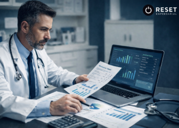 Médico analisando indicadores financeiros e relatórios de desempenho em clínica com gráficos e dados operacionais